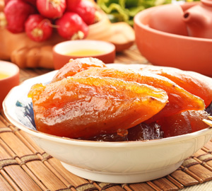 Boniatos asados en alm�bar de naranja y peras caramelizadas